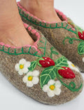 Woolen slippers with floral and strawberry design on a white background