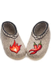 Pair of warm woolen house shoes slippers with flame and chili pepper designs on a gray background  for men