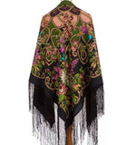 Colorful patterned black and peach shawl palatine made of cashmere like merino wool with fringes on a white background