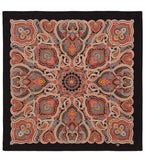 Decorative paisley patterned large square shawl made of natural merino wool on a black background