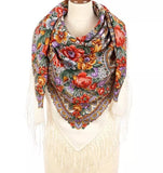 An extra-large white merino scarf for woman inspired by Slavic national patterns, featuring herbal motifs in red and yellow - field flowers in vintage style. The vintage look is balanced with luxurious natural merino and a delicate silky fringe for timeless appeal.