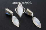 A set of sterling silver 925 jewelry featuring moonstone and labradorite, including earrings and a ring, with some parts gold plated.