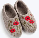 Pair of brown woolen slippers with red floral patterns on a white background