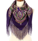 Woolen shawl with fringe in dark purple almost navy color. The pattern is herbal in green and beige.