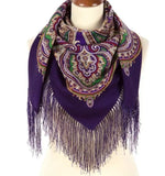 Woolen shawl with fringe in dark purple almost navy color. The pattern is herbal in green and beige.