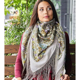 A woman wearing this fashionable shawl will love the gentle mint and purple tones. The silky fringe feels light and elegant, and the shawl wraps easily around the shoulders for a cozy, chic look.