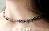 A sterling silver 925 necklace with marcasite small flowers and black onyx gemstones, displayed around a person's neck and with Armenian Spirit title.