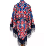 Floral patterned vintage folk Slavic shawl with fringes. The shawl`s color is blue and the flowers are red. 