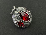 Elevate your style with our Sterling Silver 925 Handmade Armenian Jewelry. Our pomegranate brooch, adorned with a red transparent stone, is a symbol of prosperity and abundance. Handcrafted by skilled Armenian artisans, each piece is unique. Add a touch of cultural elegance to any outfit with our jewelry.
