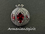 Expertly crafted by Armenian artisans, this Sterling Silver 925 Pomegranate Brooch is a true work of art. The intricate design and use of red transparent stone perfectly capture the beauty and symbolism of the pomegranate. Elevate any outfit with this stunning handmade jewelry.

