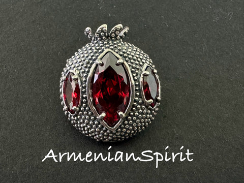 Expertly crafted by Armenian artisans, this Sterling Silver 925 Pomegranate Brooch is a true work of art. The intricate design and use of red transparent stone perfectly capture the beauty and symbolism of the pomegranate. Elevate any outfit with this stunning handmade jewelry.
