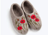 Pair of gray woolen slippers with red poppies floral patterns on a white background
