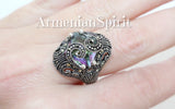 Small ring with luxury rainbow topaz and marcasite on a woman hand with Armenian Spirit title.