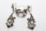 A set of sterling silver jewelry including long earrings and a ring, featuring marcasite and a pale green artificial topaz stone, displayed against a white background.