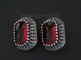 A pair of sterling silver rectangle earrings with red lab topaz and white zircons. Vintage jewelry with marcasite.