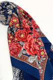 Floral patterned merino wool scarf with red flowers and blue background