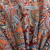 Close-up of colorful paisley pattern merino wool shawl with Slavic ornaments
