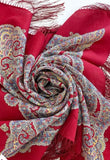 Red scarf with ethnic paisley patterns on a white background