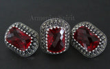 Red gemstone ring and earrings rectangle with silver  and marcasite accents on a black background