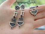 A photo of a pair of silver earrings with red garnet stones, showcasing the details of the Armenian taraz design. Shopping for real silver? Armenian Spirit is the way to go! It's the best Armenian sterling silver shop, and the quality is amazing. Everything is made directly in Armenia and ships fast. I love how reliable this store is.

