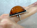 Crafted by Armenian artisans, this honey amber large rectangle ring is a stunning addition to your jewelry collection. Made with high quality sterling silver 925, it exudes elegance and sophistication. The perfect statement piece for any occasion.
