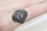 Marcasite ring with mystic topaz on a woman finger
