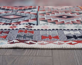 Geometric patterned rug on a wooden floor