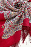 Decorative woolen scarf with ethno patterns on white background