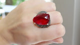 Expertly handcrafted in Armenia, this stunning 925 sterling silver ring features precious marcasite details and a striking ruby red transparent stone. The vintage-inspired design exudes both quality and style, making it a timeless addition to any jewelry collection. Elevate your look with this exquisite handmade Armenian jewelry.
