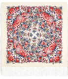 An e-commerce product photograph highlighting a premium ivory woolen shawl. The blanket-style scarf is showcasing dense, traditional Slavic floral arrangements in warm pink and contrasting slate blue tones.