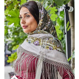 This mint and purple shawl with long silky fringe is beautiful in motion. A woman wearing it looks modern and bohemian at the same time. The large size makes it perfect for wrapping and layering.