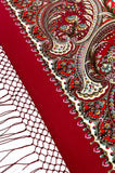 Red wrapping shawl with intricate paisley pattern and silky fringe