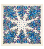 Floral patterned Slavic shawl with blue and purple flowers on a beige background