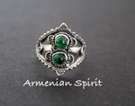 Experience the intricate craftsmanship of traditional Armenian jewelry with our Sterling Silver 925 handmade thumb ring. Adorned with bright green stones, this ring is inspired by Western Armenian designs. Its small size fits perfectly on thumb sizes 4.5 and 5. Add a touch of elegance to your style with this unique piece.
