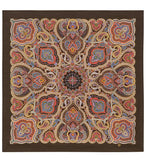 Colorful paisley patterned mandala patterned cashmere shawl on a brown background.
