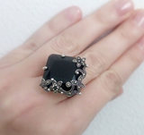 Marcasite ring with black square stone on a hand