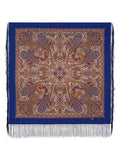 Paisley patterned scarf with fringes on a blue base. 