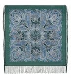 Shawl with light blue pattern on a green base made of 100% merino wool and silky fringe.