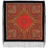 Decorative square shawl with golden paisley pattern on a red background and with black fringe.