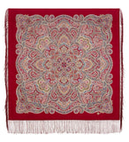Decorative throw shawl with intricate paisley pattern on a red background