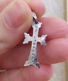 Cross sterling silver reverse side with title Echmiadzin on a women`s hand.