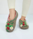 Natural merino wool slippers with strawberry design on a white background