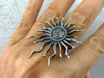 Expertly crafted by Armenian artisans, this sterling silver 925 Vaspourakan band ring boasts traditional taraz ornaments for a touch of cultural flair. The Sun Large Ring features big, long rays, making it a striking addition to any jewelry collection. Elevate your style with this handcrafted piece of jewelry.
