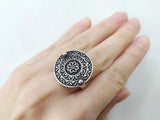 Armenian traditional ring with round design with a taraz flower design, crafted from oxidized sterling silver.