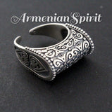 A set of sterling silver 925 jewelry including a dome ring and a pair of long earrings with traditional Armenian patterns.