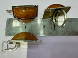 Experience the exquisite craftsmanship of Armenian artisan jewelry with our high quality sterling silver 925 collection. Each piece features a unique honey amber big stone set in a classic rectangle ring and earrings. Don't miss the opportunity to own a one of a kind, single copy piece of jewelry. Elevate your style with our exclusive collection.
