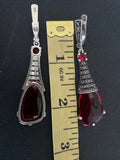 Elevate your jewelry collection with our luxurious sterling silver earrings from Armenian Spirit jewelry store. These classic earrings feature a transparent red stone and exquisite marcasite, making them perfect for any occasion. Stand out at parties and shine like a star in Monaco's French Riviera. Purchase online and experience the high quality that we offer.
