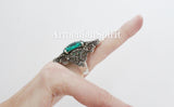 Very long ring with marcasite and green emerald stone with Armenian Spirit title.