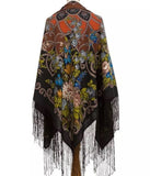 Colorful vintage patterned shawl with fringes on a white background