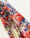 High-quality merino wool palantine for women featuring detailed heritage floral scrollwork, styled on a mannequin torso.